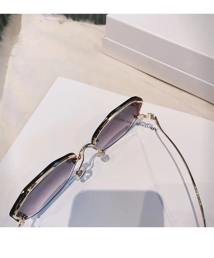 Trendy fashionable polygonal frameless cut edge sunglasses women's metal curved legs retro street photo sunglasses