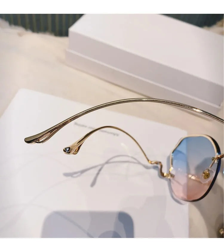Trendy fashionable polygonal frameless cut edge sunglasses women's metal curved legs retro street photo sunglasses