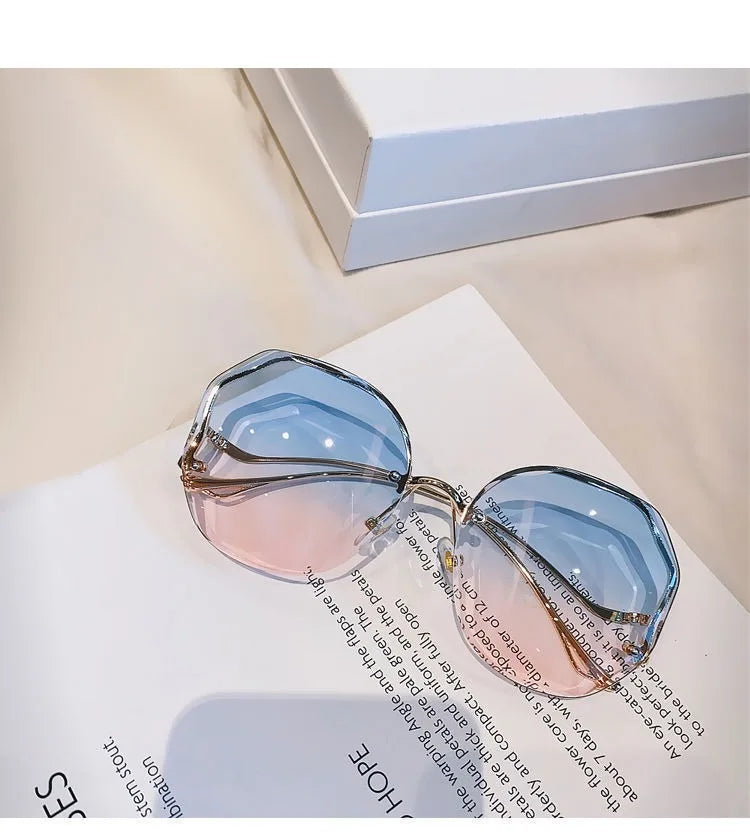 Trendy fashionable polygonal frameless cut edge sunglasses women's metal curved legs retro street photo sunglasses