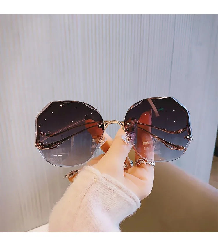 Trendy fashionable polygonal frameless cut edge sunglasses women's metal curved legs retro street photo sunglasses